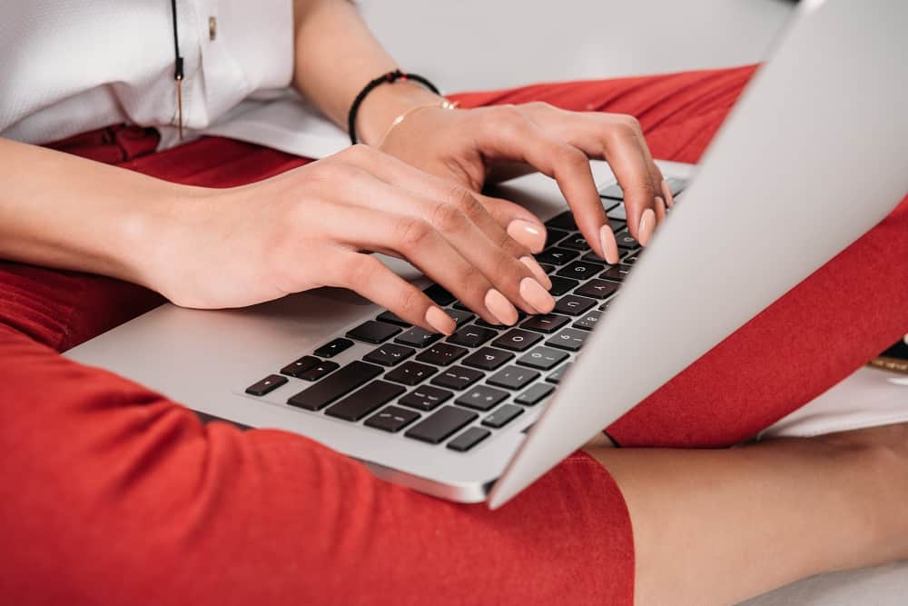 a woman doing blog planning on a laptop